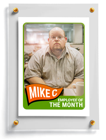 Work trading card named Spartacus with a photo of a man and 'Employee of the Month' text on a white background